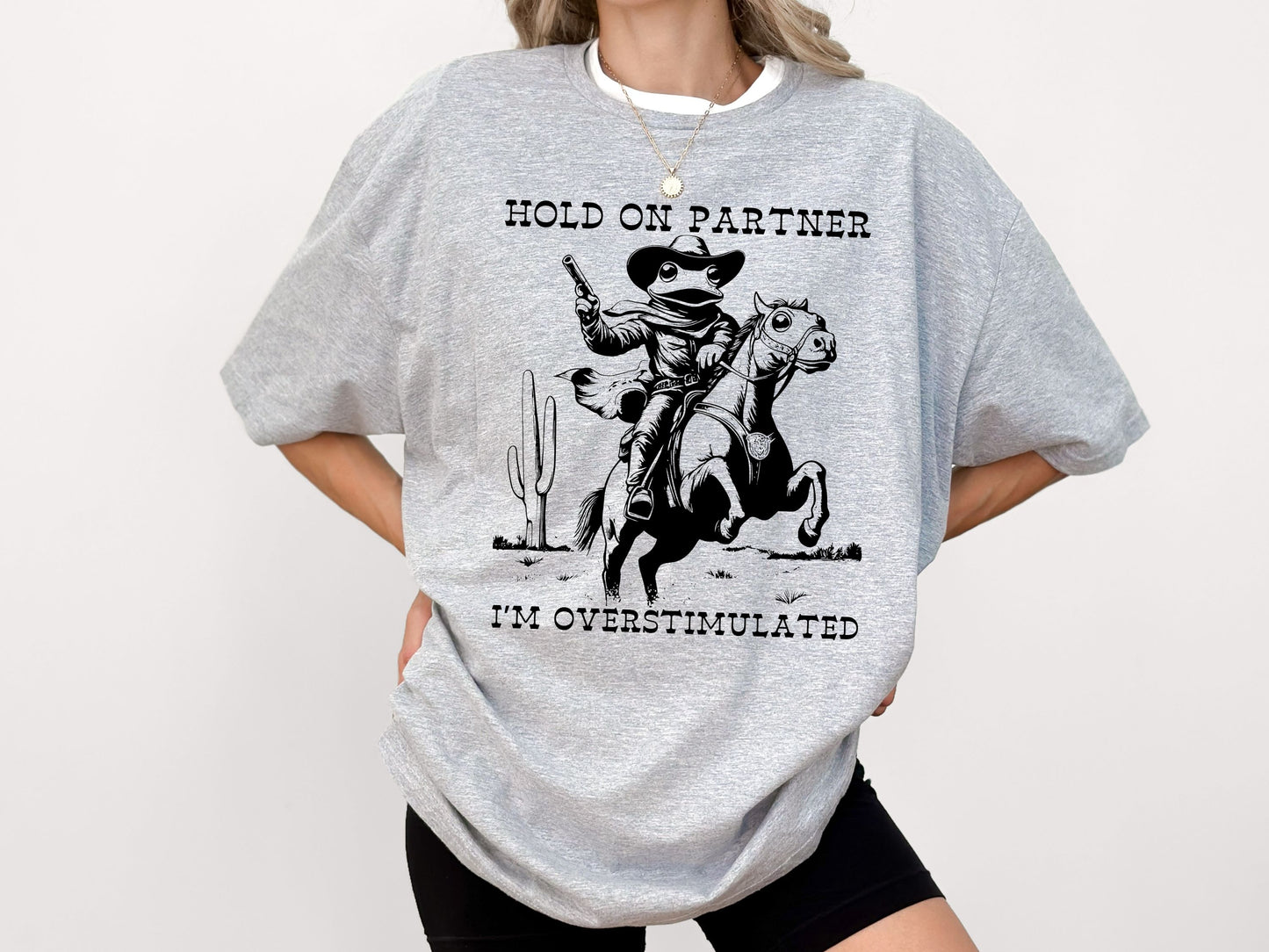 Hold On Partner I'm Overstimulated Shirt, Funny Frog T-Shirt, Cute Animal T-Shirt, Cowboy Frog Shirt, Cowboy Frog Riding A Horse T-Shirt